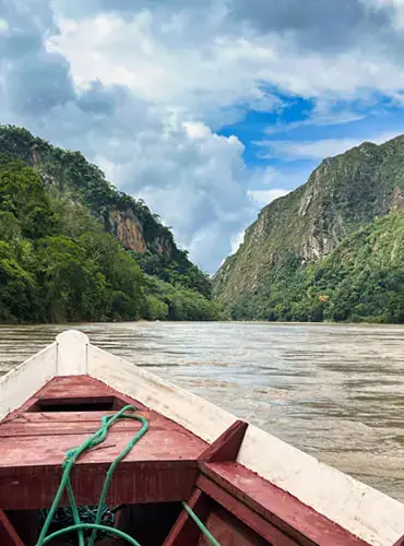 Boat tour on Río Beni and Río Tuichi in Madidi National Park exploring winding waterways and Amazon rainforest Bolivia